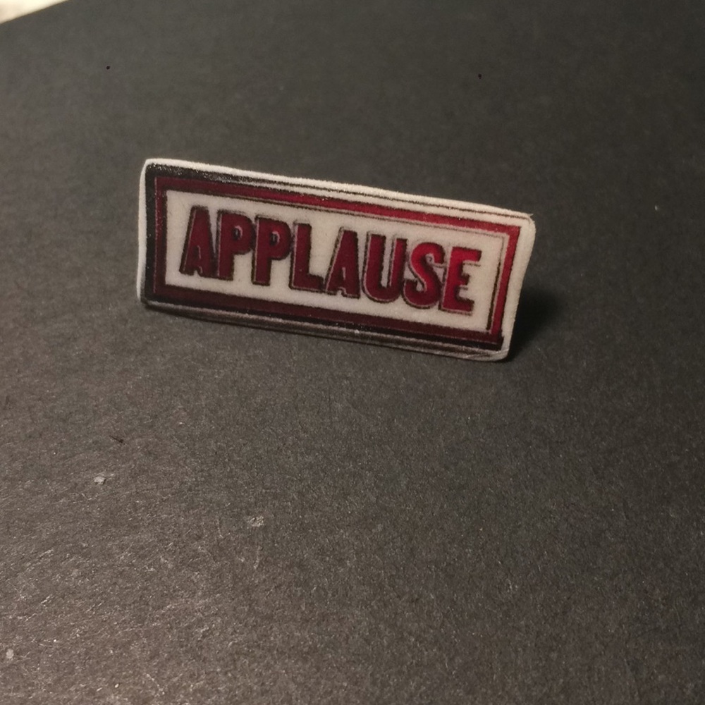 Applause pin
